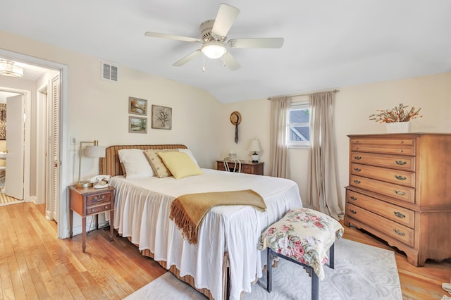 bedroom with light wood finished floors and a ceiling fan