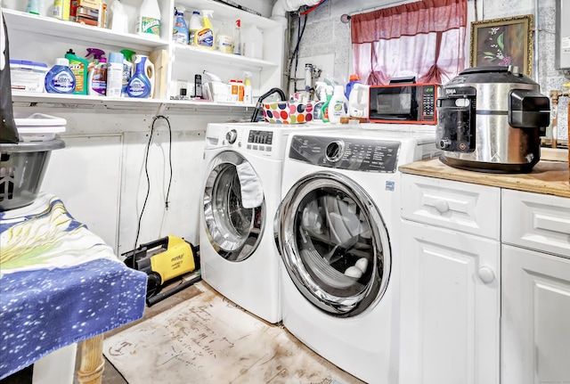 laundry room featuring washing machine and clothes dryer