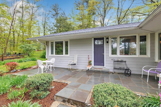 doorway to property featuring a patio area