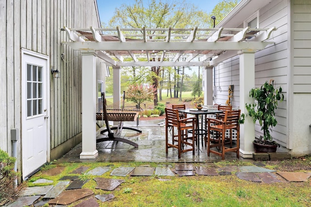 view of patio with a pergola and outdoor dining space