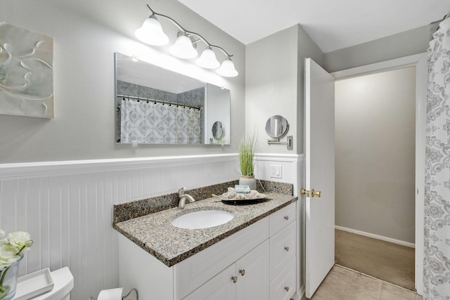 451 Jones Hollow Rd, Marlborough, CT 06447 - full bathroom with vanity, wainscoting, and tile patterned flooring