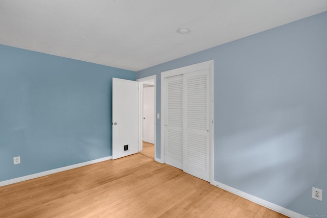 451 Jones Hollow Rd, Marlborough, CT 06447 - unfurnished bedroom with a closet and wood finished floors