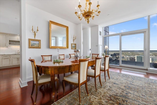 dining space with floor to ceiling windows, wood finished floors, and a chandelier