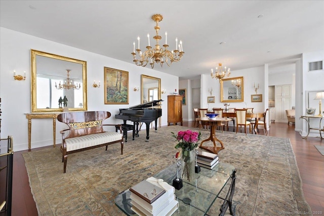 living area featuring a chandelier, wood finished floors, and baseboards