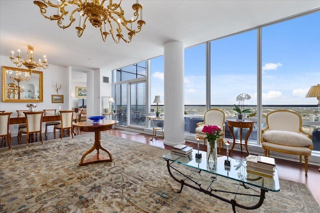 living room with a chandelier, wood finished floors, and floor to ceiling windows