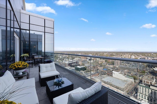 balcony featuring a view of city and outdoor lounge area