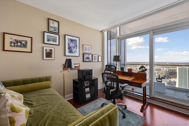 office area with hardwood / wood-style floors and baseboards