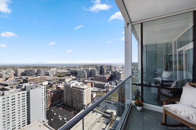 balcony with a city view and a sunroom
