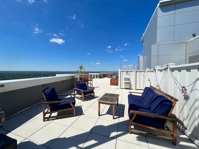 view of patio / terrace featuring an outdoor hangout area and a water view
