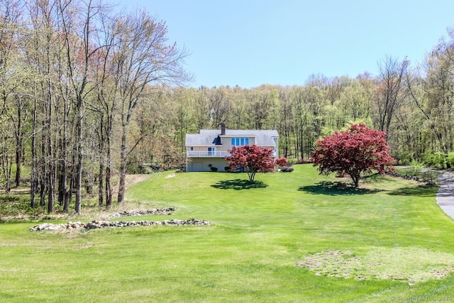 view of yard with a wooded view