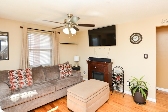 61 Kenyon Cir, New Britain, CT 06053 - living room with a ceiling fan, baseboards, a glass covered fireplace, and wood finished floors