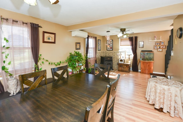 61 Kenyon Cir, New Britain, CT 06053 - dining area featuring light wood-style floors, baseboards, a ceiling fan, and an AC wall unit