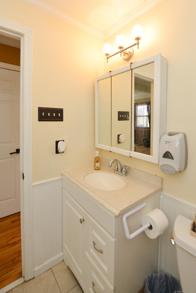 61 Kenyon Cir, New Britain, CT 06053 - half bath featuring toilet, a wainscoted wall, vanity, crown molding, and tile patterned flooring