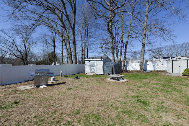 61 Kenyon Cir, New Britain, CT 06053 - view of yard featuring an outbuilding, a fenced backyard, and a storage unit