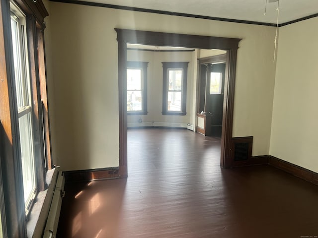 78-80 Cabot St, Hartford, CT 06154 - empty room with dark wood-type flooring, baseboards, a baseboard heating unit, and crown molding
