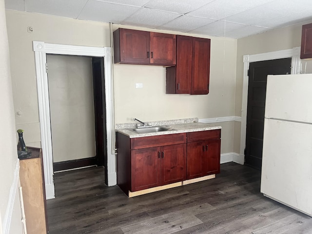 78-80 Cabot St, Hartford, CT 06154 - kitchen featuring freestanding refrigerator, a sink, reddish brown cabinets, dark wood-style floors, and light countertops