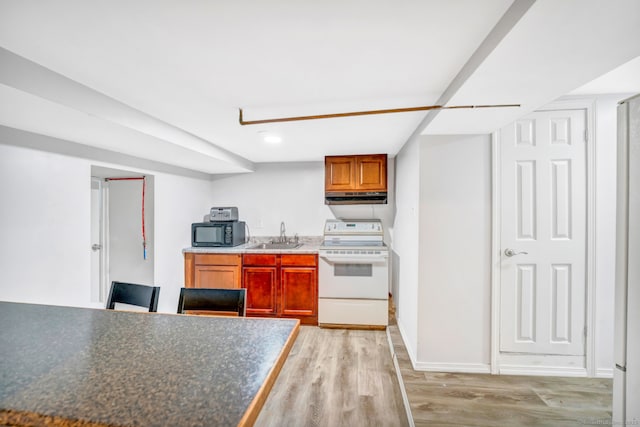 kitchen with white electric range, under cabinet range hood, black microwave, light wood-type flooring, and a sink