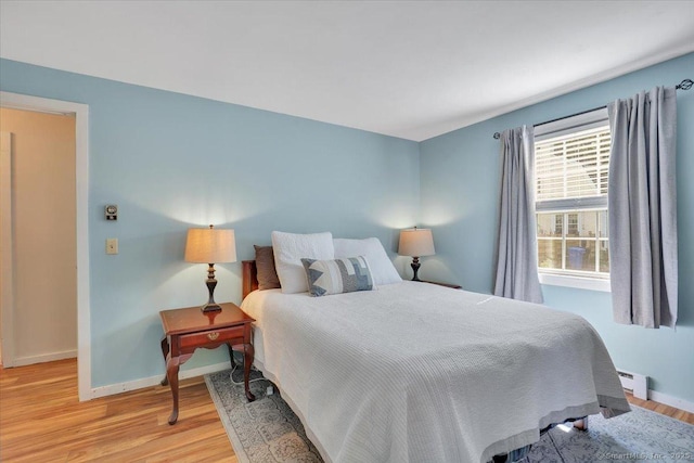 10 Falls River Cir, Essex, CT 06442 - bedroom featuring baseboards, a baseboard heating unit, and light wood finished floors
