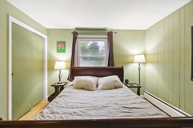 bedroom featuring wood finished floors and a closet