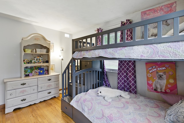 bedroom with wood finished floors