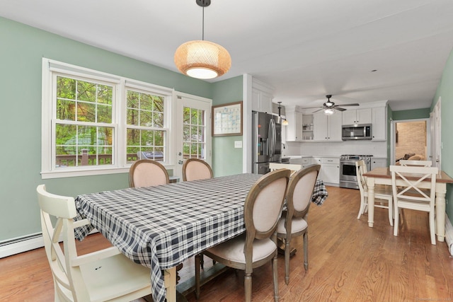 dining room featuring light wood-style flooring and ceiling fan