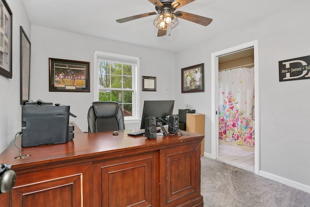 home office with ceiling fan, carpet, and baseboards