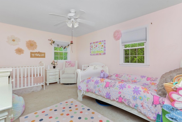 carpeted bedroom featuring a ceiling fan