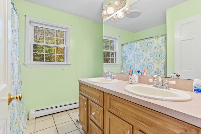 full bath with a baseboard heating unit, tile patterned floors, double vanity, and a chandelier