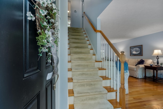 stairway with wood finished floors