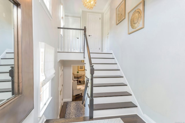 38 Heritage Hill Rd Unit 38, New Canaan, CT 06840 - staircase with healthy amount of natural light, baseboards, a chandelier, a towering ceiling, and ornamental molding