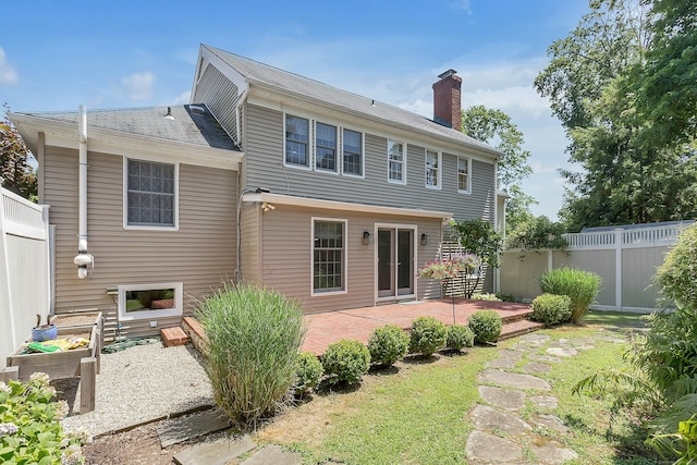 38 Heritage Hill Rd Unit 38, New Canaan, CT 06840 - rear view of property with fence, a chimney, and a patio area