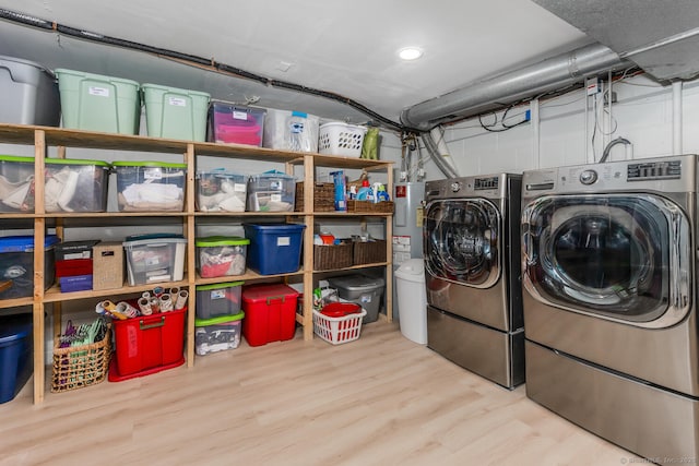 38 Heritage Hill Rd Unit 38, New Canaan, CT 06840 - laundry room featuring wood finished floors, electric water heater, and washer and dryer