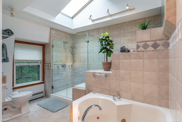 bathroom with a skylight, a stall shower, a whirlpool tub, toilet, and a baseboard radiator