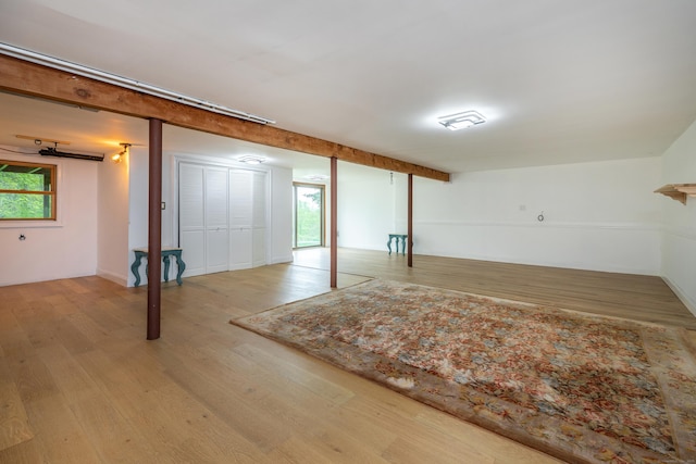 basement featuring wood finished floors and plenty of natural light