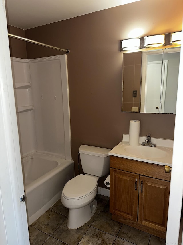 full bath with toilet, vanity, tile patterned floors, and bathing tub / shower combination