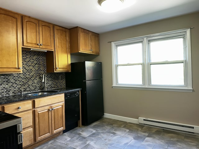 kitchen with black appliances, a sink, tasteful backsplash, and brown cabinets