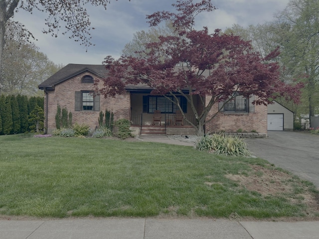view of front of home with a porch, brick siding, a front lawn, a garage, and concrete driveway