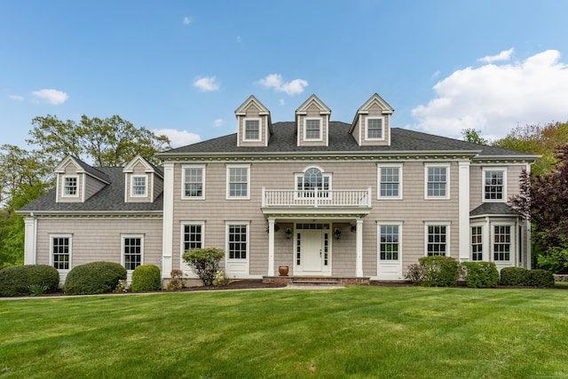 61 Governors Way, Madison, CT 06443 - colonial-style house with a balcony, a front lawn, and a shingled roof