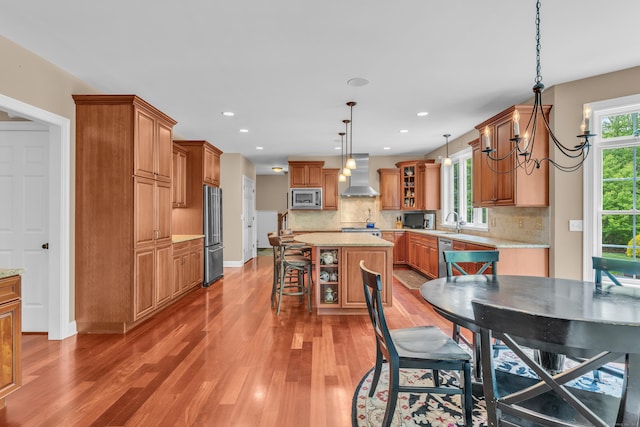 61 Governors Way, Madison, CT 06443 - dining area featuring light wood-style flooring, recessed lighting, a chandelier, and baseboards