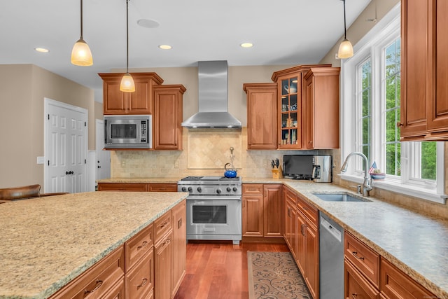 61 Governors Way, Madison, CT 06443 - kitchen featuring appliances with stainless steel finishes, a sink, wall chimney range hood, healthy amount of natural light, and recessed lighting