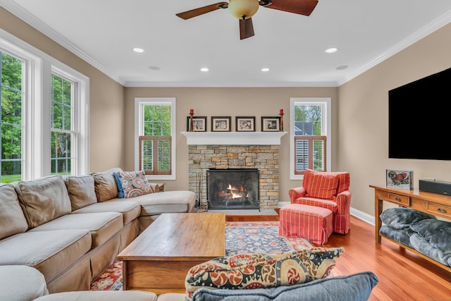 61 Governors Way, Madison, CT 06443 - living area featuring plenty of natural light, wood finished floors, crown molding, baseboards, and a ceiling fan