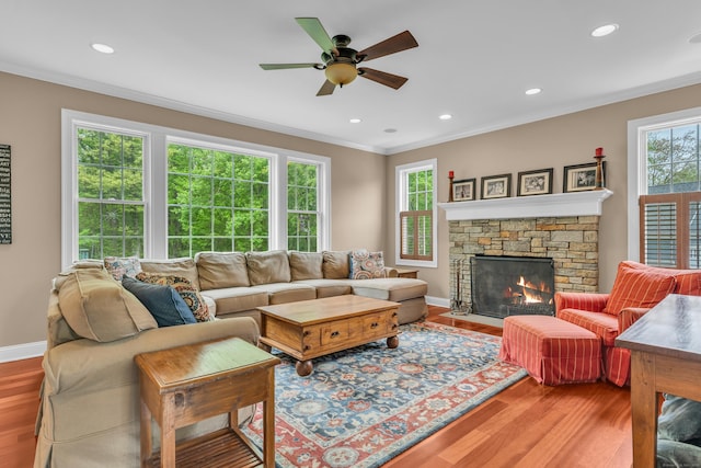 61 Governors Way, Madison, CT 06443 - living room with ornamental molding, wood finished floors, a ceiling fan, a fireplace, and baseboards
