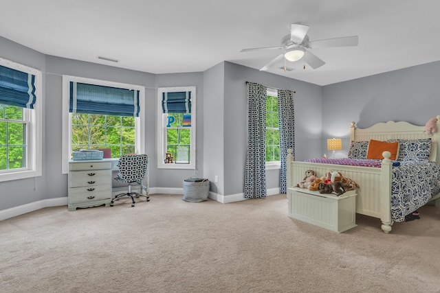 61 Governors Way, Madison, CT 06443 - carpeted bedroom featuring multiple windows, baseboards, and ceiling fan