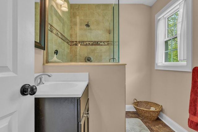 61 Governors Way, Madison, CT 06443 - bathroom with a tile shower, healthy amount of natural light, baseboards, and vanity