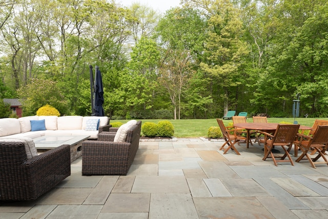 61 Governors Way, Madison, CT 06443 - view of patio / terrace with an outdoor living space, outdoor dining area, and view of wooded area