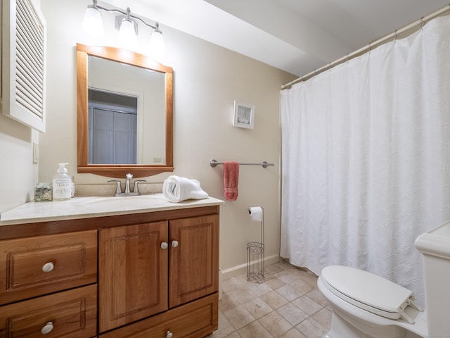 full bath with toilet, vanity, baseboards, and tile patterned flooring