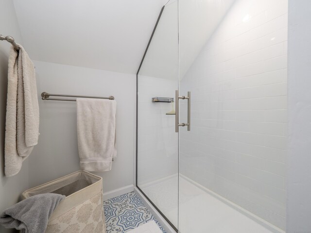 120 Prospect St Apt 2, Ridgefield, CT 06877 - bathroom featuring tiled shower and vaulted ceiling