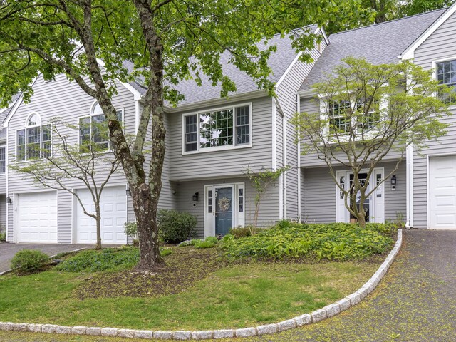 120 Prospect St Apt 2, Ridgefield, CT 06877 - view of front of property featuring an attached garage, asphalt driveway, and roof with shingles
