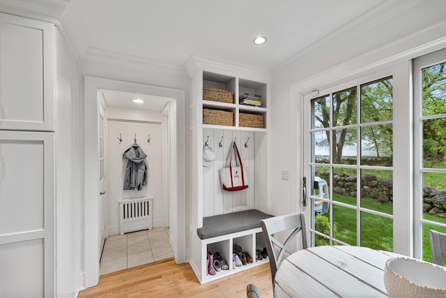 mudroom with ornamental molding, light wood finished floors, and recessed lighting