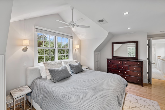 bedroom featuring light wood-style flooring, vaulted ceiling, ceiling fan, and recessed lighting